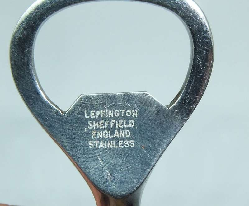 A VINTAGE CARVED BONE DOG MOTIF BOTTLE OPENER BY LEPPINGTON SHEFFIELD ENGLAND