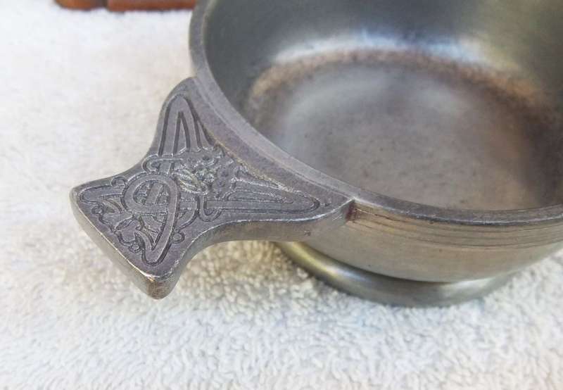 A VINTAGE PEWTER QUAICH WITH CELTIC PATTERN HANDLES MADE IN SCOTLAND BY THE QUAICH COMPANY