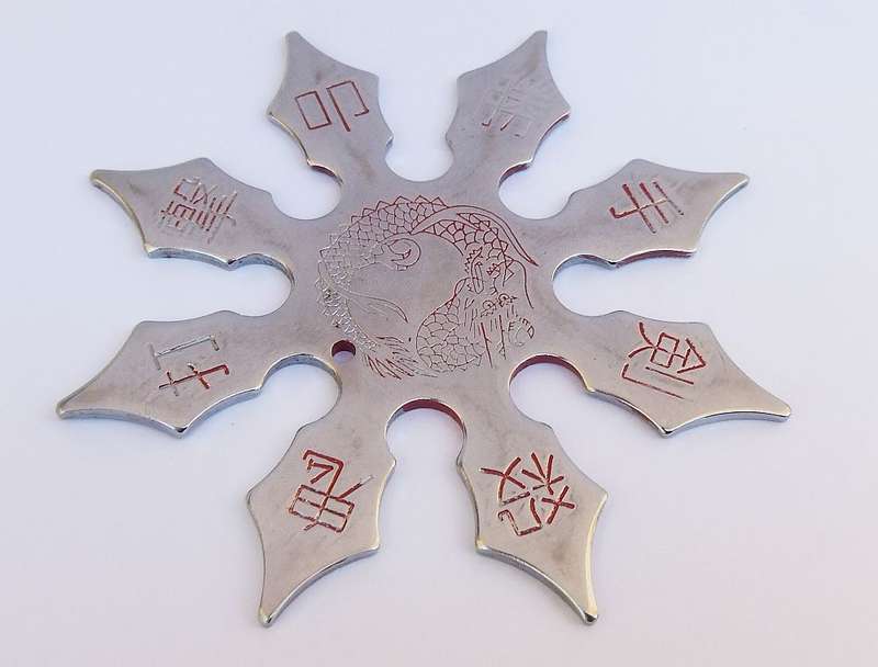 TWO TOTALLY COOL VINTAGE JAPANESE MADE NINJA STARS WITH DRAGON MOTIF !!