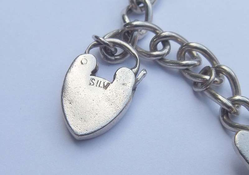 Sterling Silver Charm Bracelet with Designer Charm - Good Quality Piece