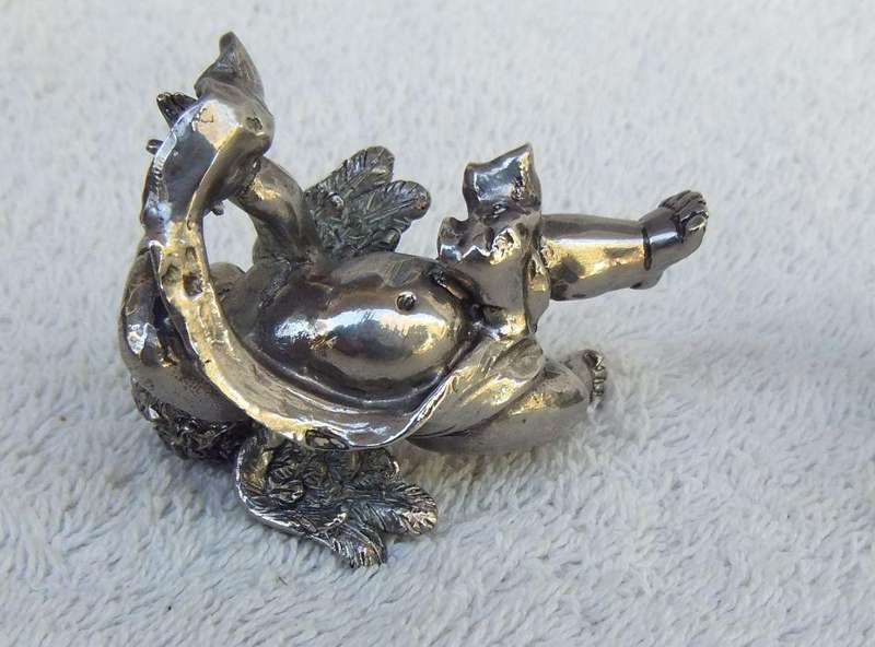 A PAIR OF CHERUB ORNAMENTS DIPPED IN A SILVER METAL FINISH - NO MARKINGS