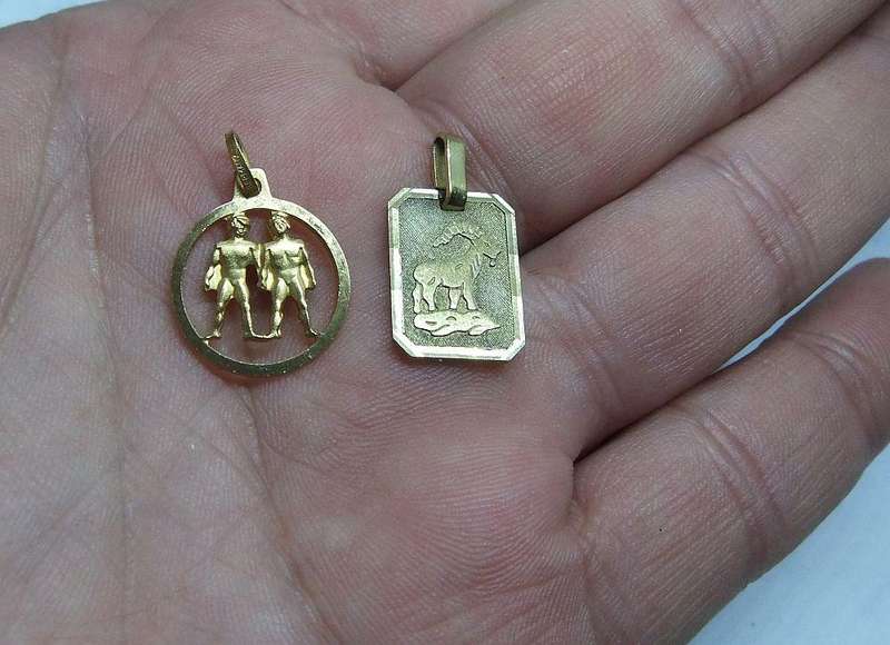 A LOT OF 9 VINTAGE UNUSED GOLD PLATED ZODIAC MOTIF PENDANTS MADE IN GERMANY