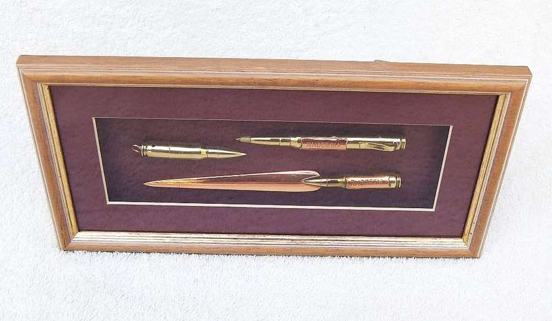 RARE FIND !! A VINTAGE BOX FRAME CONTAINING THREE PIECES OF RHODESIAN BUSH WAR TRENCH ART !! WOW !!