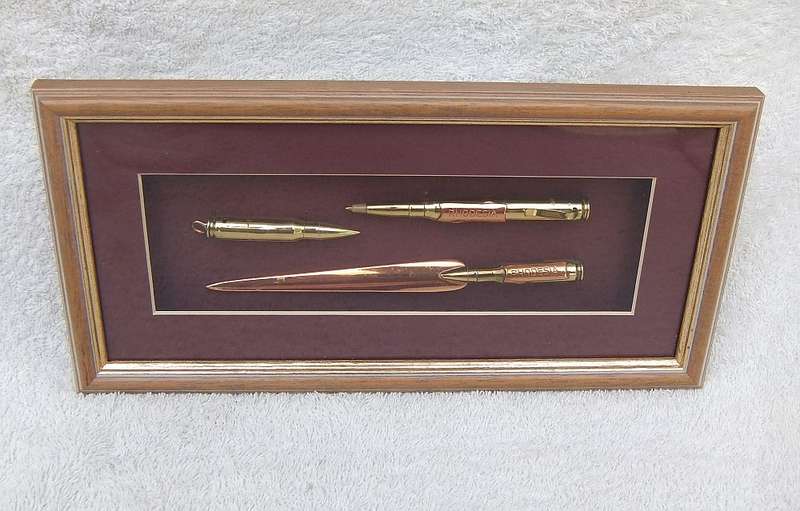 RARE FIND !! A VINTAGE BOX FRAME CONTAINING THREE PIECES OF RHODESIAN BUSH WAR TRENCH ART !! WOW !!