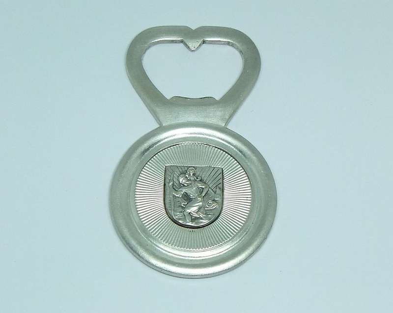 A VINTAGE SILVERPLATE BOTTLE OPENER DEPICTING ST. CHRISTOPHER