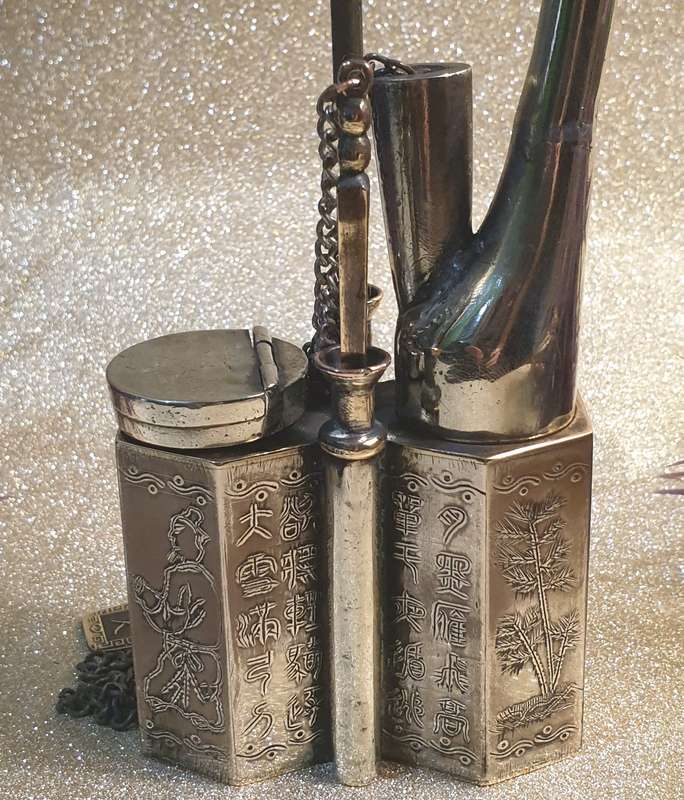 A Chinese white metal opium pipe