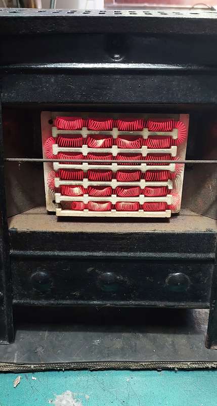 Stunning small steel and cast iron heater from the early 50's . Working
