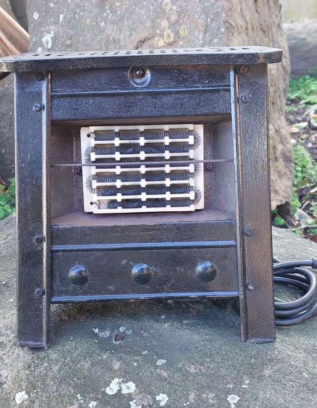 Stunning small steel and cast iron heater from the early 50's . Working