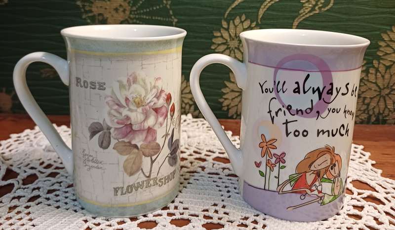TWO COFFEE CUPS