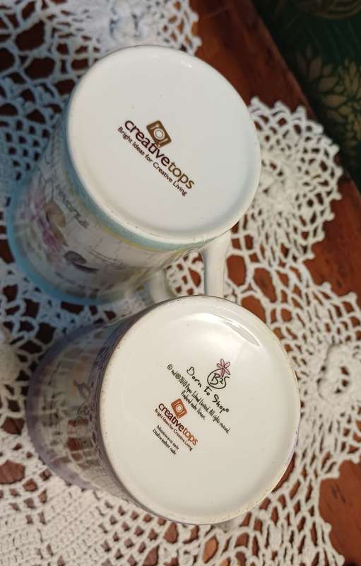 TWO COFFEE CUPS