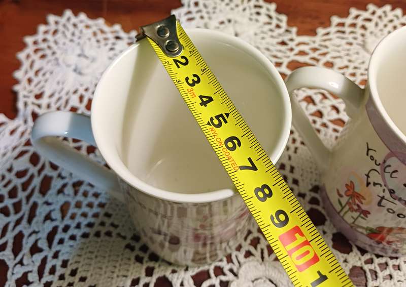 TWO COFFEE CUPS