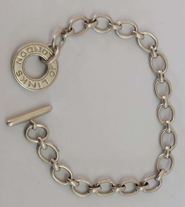 Wow!! Links of London hallmarked silver charm bracelet 15.4g value R2500