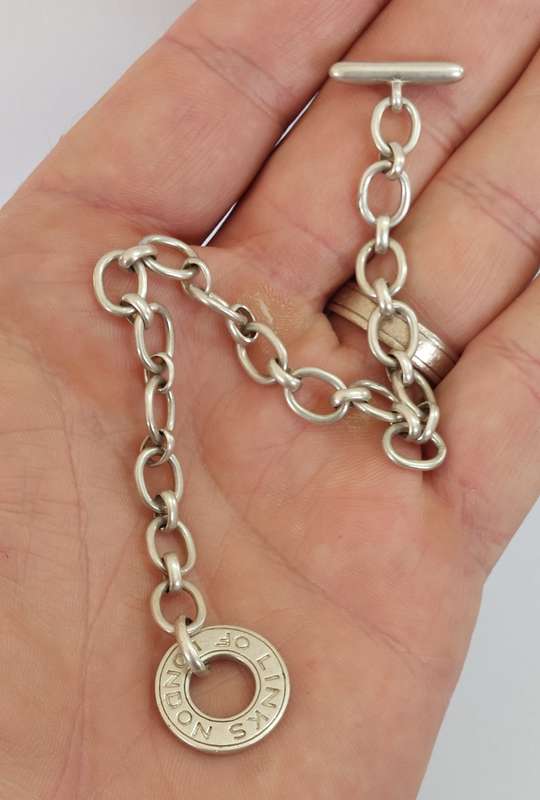 Wow!! Links of London hallmarked silver charm bracelet 15.4g value R2500
