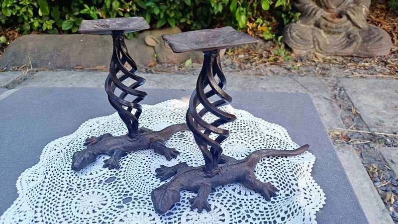 Pair of twisted metal candle stands with lizard bases