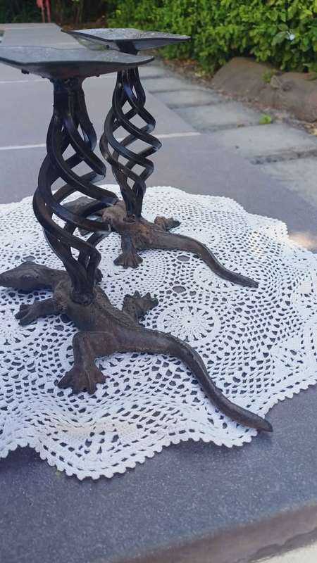 Pair of twisted metal candle stands with lizard bases