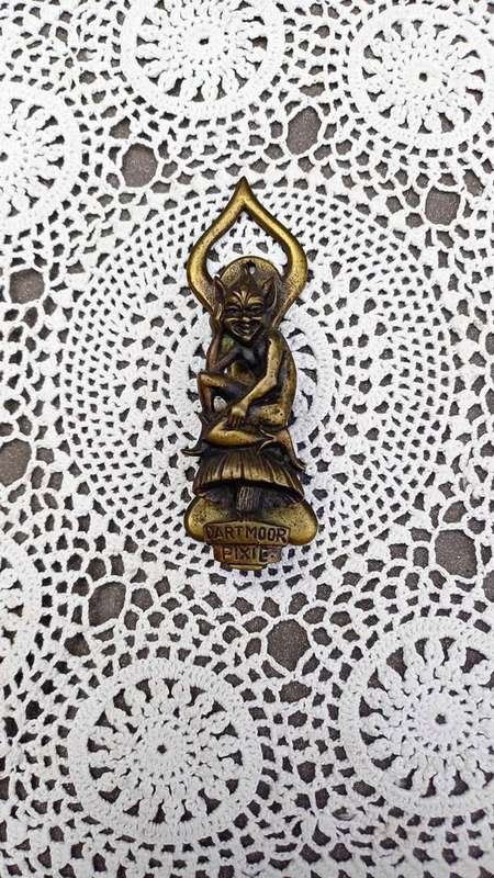 Vintage brass door knocker. Cheeky Dartmoor Pixie sitting on a toadstool