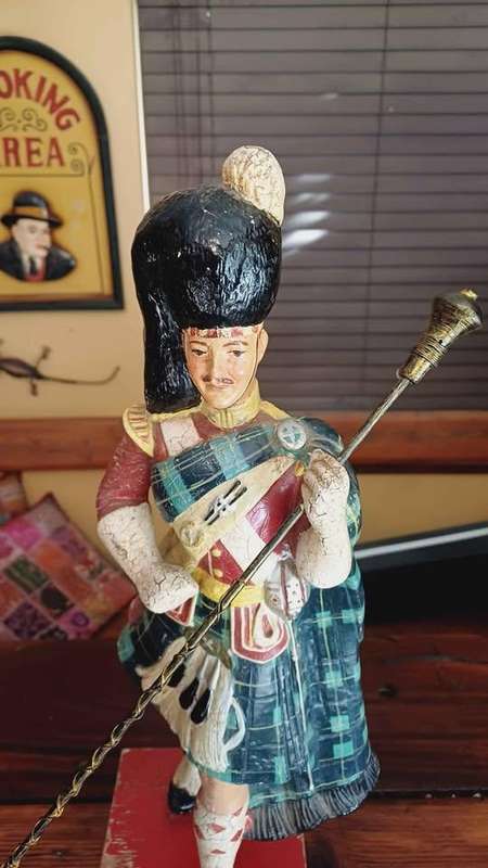 Large 1950s Dewar's White Label scotch whisky advertising statue in traditional Highland attire