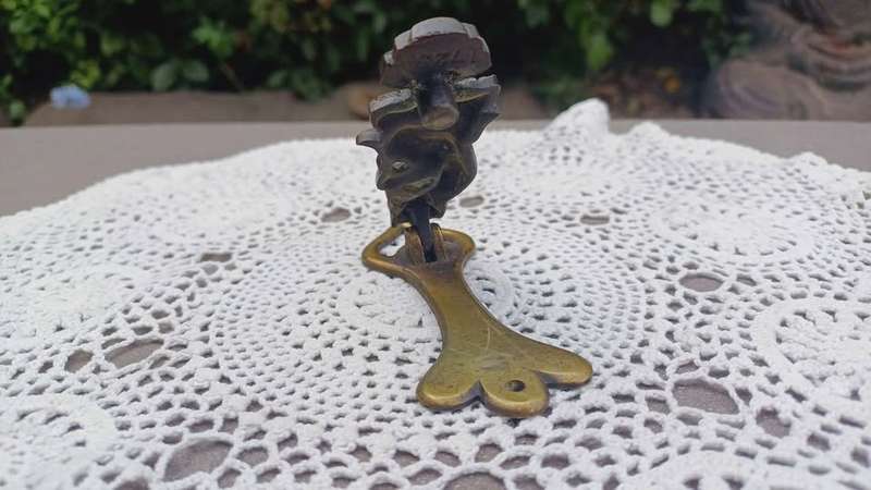 Vintage brass door knocker. Cheeky Dartmoor Pixie sitting on a toadstool
