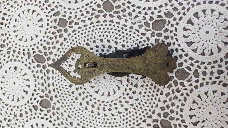 Vintage brass door knocker. Cheeky Dartmoor Pixie sitting on a toadstool