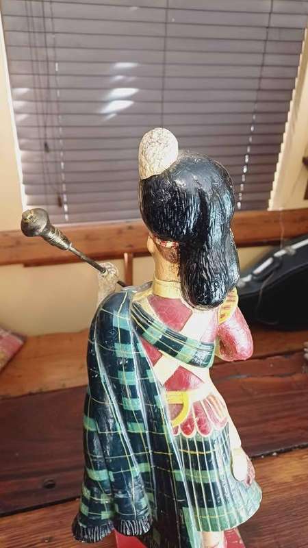 Large 1950s Dewar's White Label scotch whisky advertising statue in traditional Highland attire