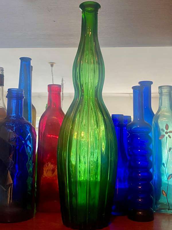 10 different sizes, coloured glassware bottles as displayed