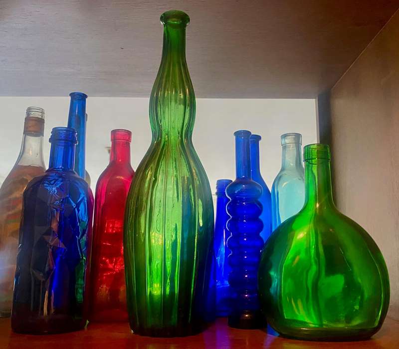 10 different sizes, coloured glassware bottles as displayed