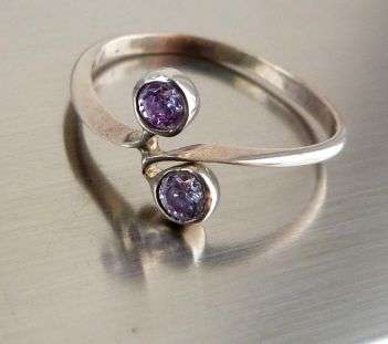 VINTAGE STERLING SILVER RING.  FACETED STONES . UNUSED