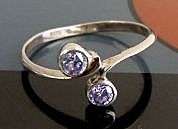 VINTAGE STERLING SILVER RING.  FACETED STONES . UNUSED