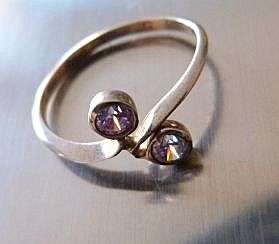 VINTAGE STERLING SILVER RING.  FACETED STONES . UNUSED