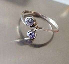VINTAGE STERLING SILVER RING.  FACETED STONES . UNUSED