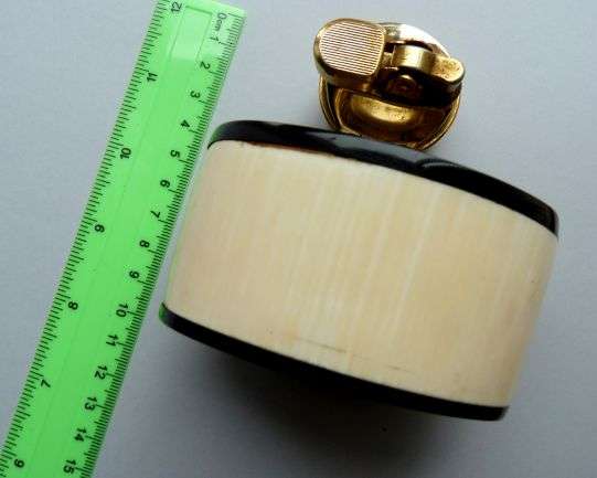 VINTAGE 'PEMGUIN" LIGHTER.  // BONE, HORN AND BRASS