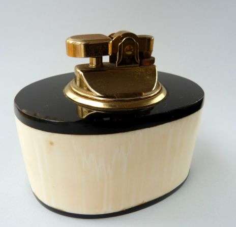 VINTAGE 'PEMGUIN" LIGHTER.  // BONE, HORN AND BRASS