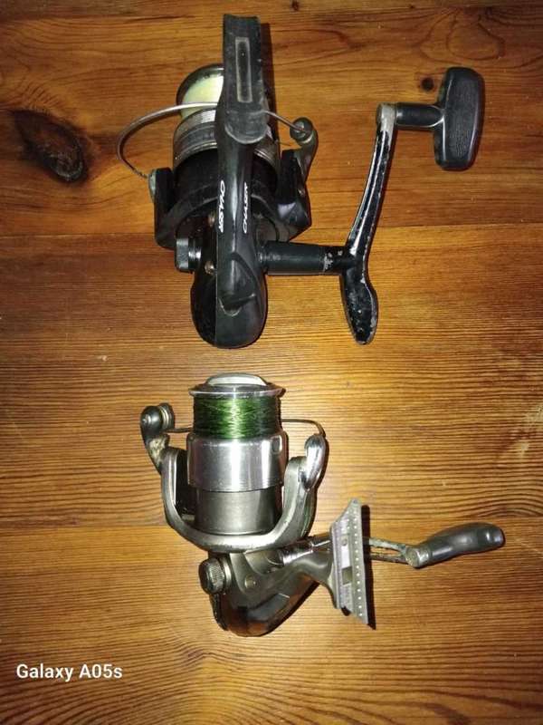 2 x SPINNING FISHING REELS.  NEED ATTENTION AS PER DESCRIPTION.