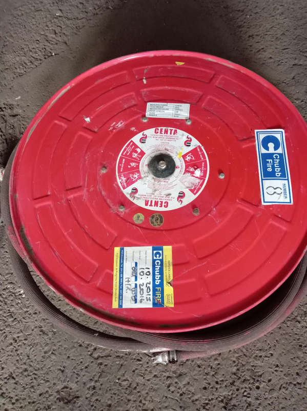 FIRE HOSE REEL. NOZZLE MISSING.