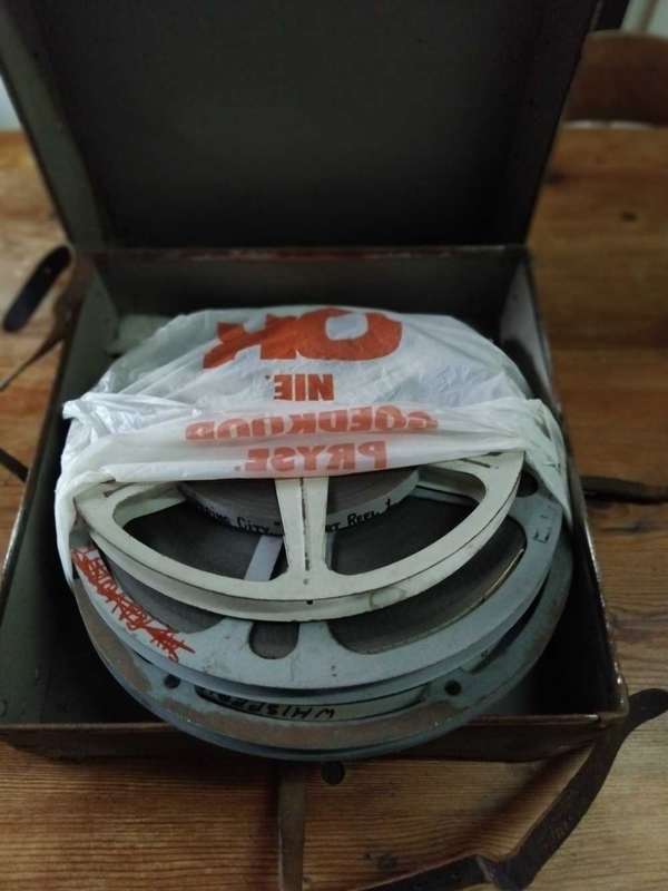 16mm MOVIE REELS IN CASE  " WHISPERING CITY "