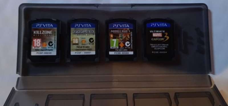 4 X PS Vita games in carry case
