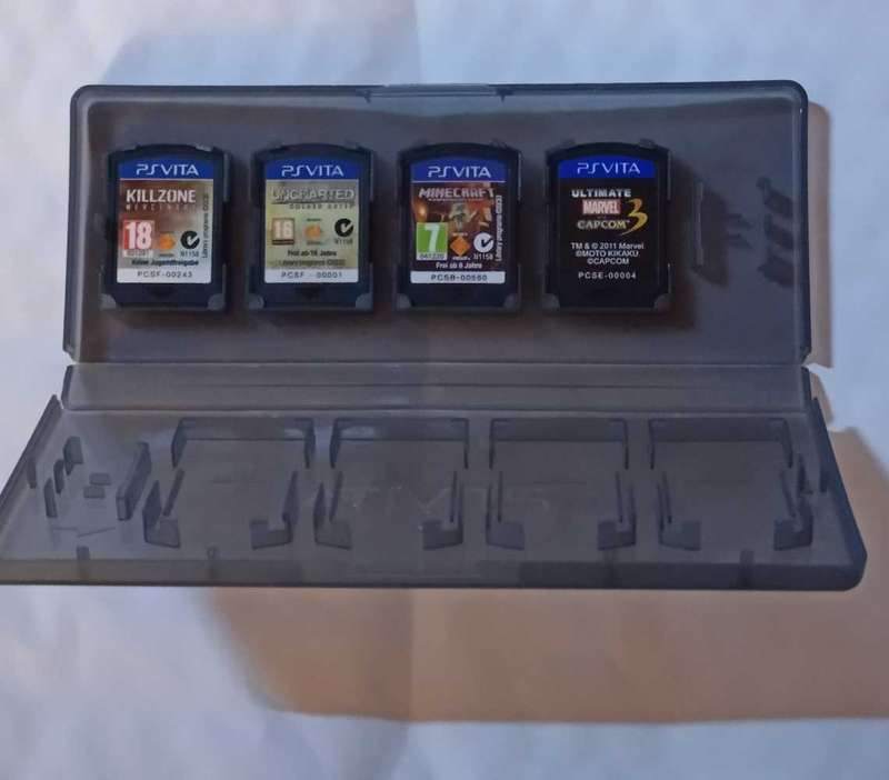 4 X PS Vita games in carry case