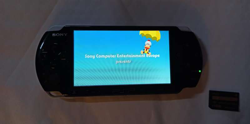 PSP Console 3004 with 8 games