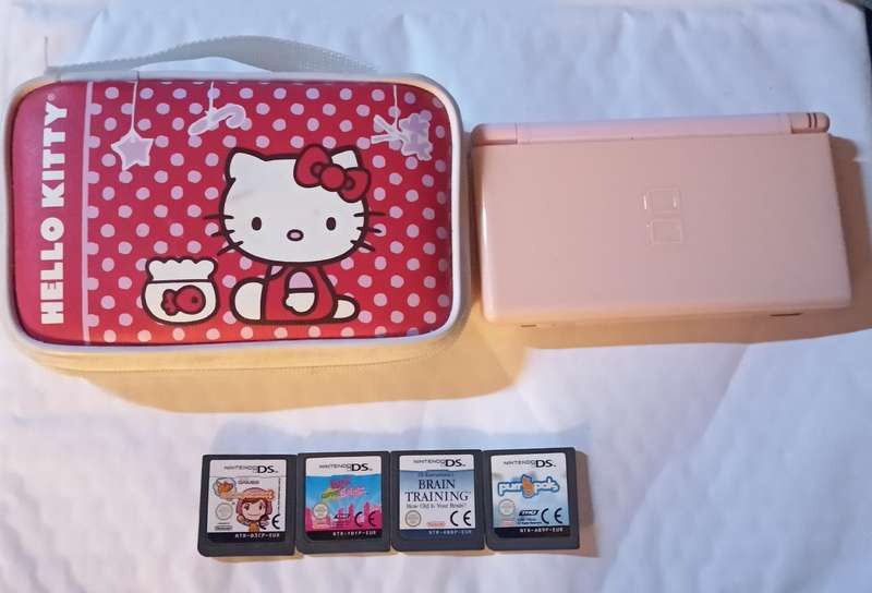 Pink Nintendo DS Lite with pouch and 4 games