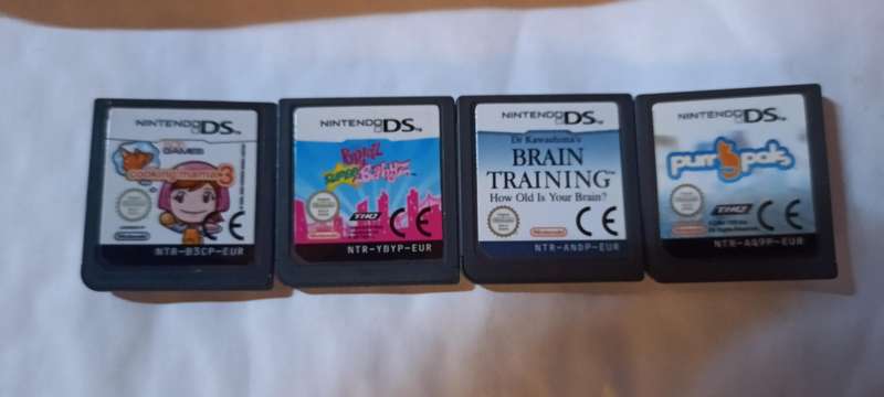 Pink Nintendo DS Lite with pouch and 4 games