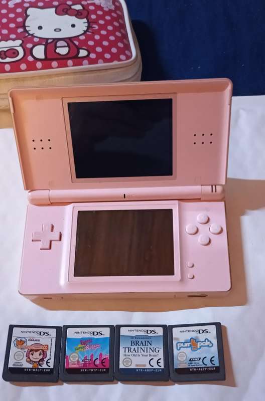 Pink Nintendo DS Lite with pouch and 4 games