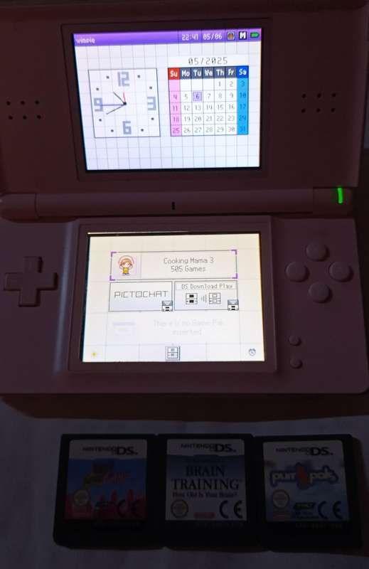 Pink Nintendo DS Lite with pouch and 4 games