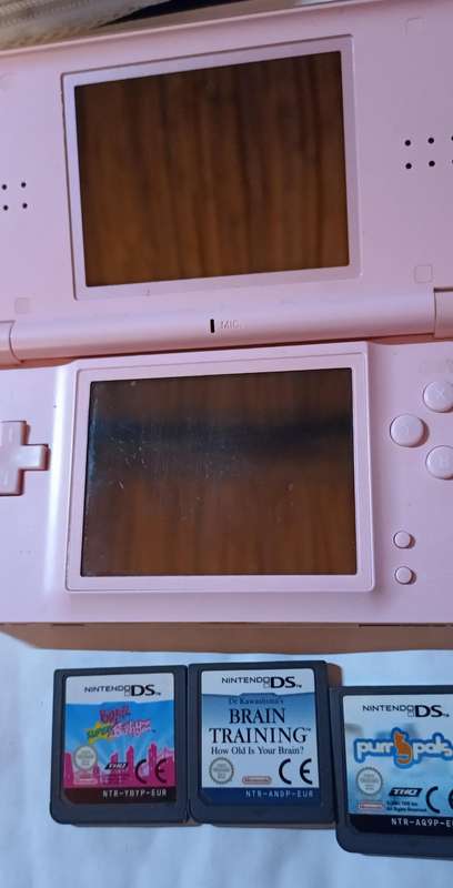 Pink Nintendo DS Lite with pouch and 4 games