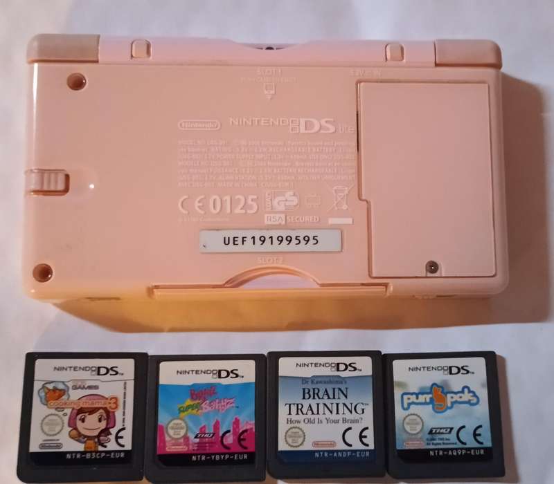 Pink Nintendo DS Lite with pouch and 4 games