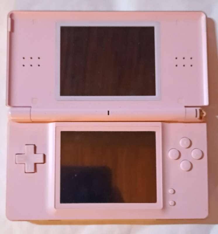 Nintendo DS Lite console with 4 games and pouch