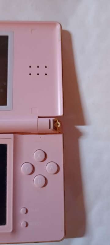 Nintendo DS Lite console with 4 games and pouch