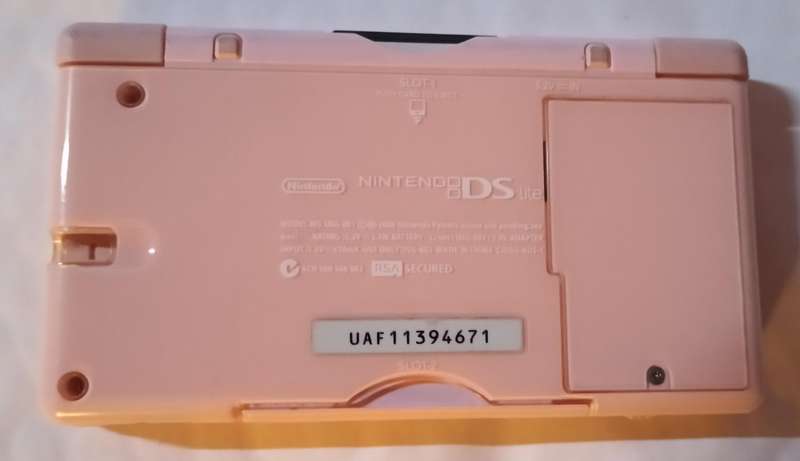 Nintendo DS Lite console with 4 games and pouch