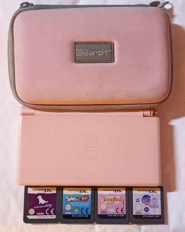 Nintendo DS Lite console with 4 games and pouch