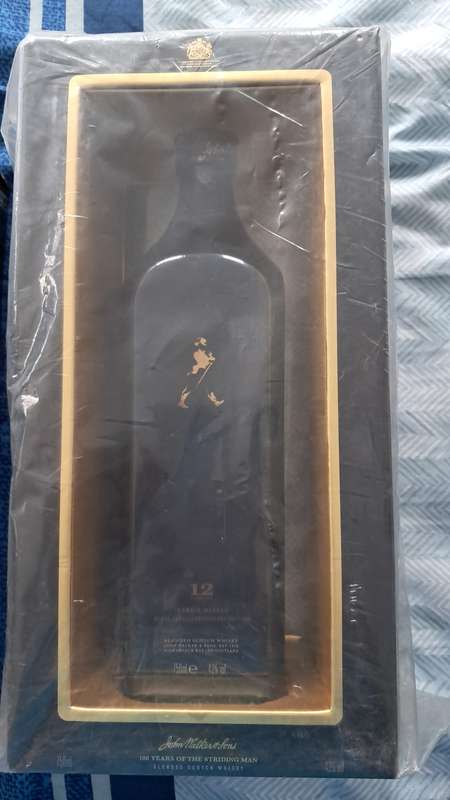 Johnnie walker 100 years of the striding man