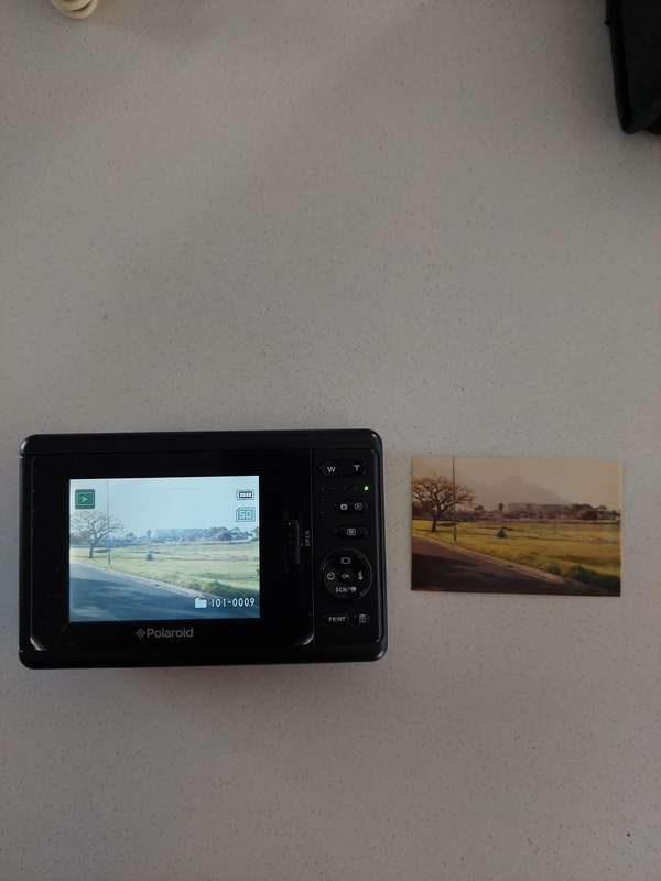 Poloroid Pogo instant digital camera (LIKE NEW) still has plastics on the camera.